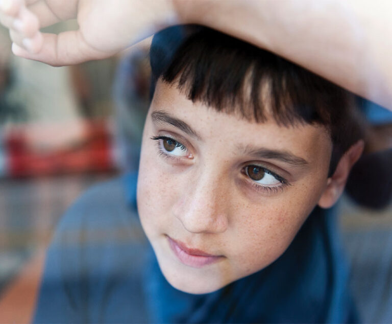 Boy looking out a window