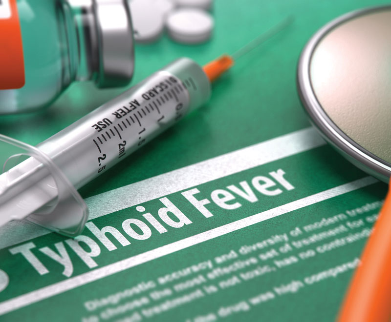 Photo of a syringe and label that says typhoid fever