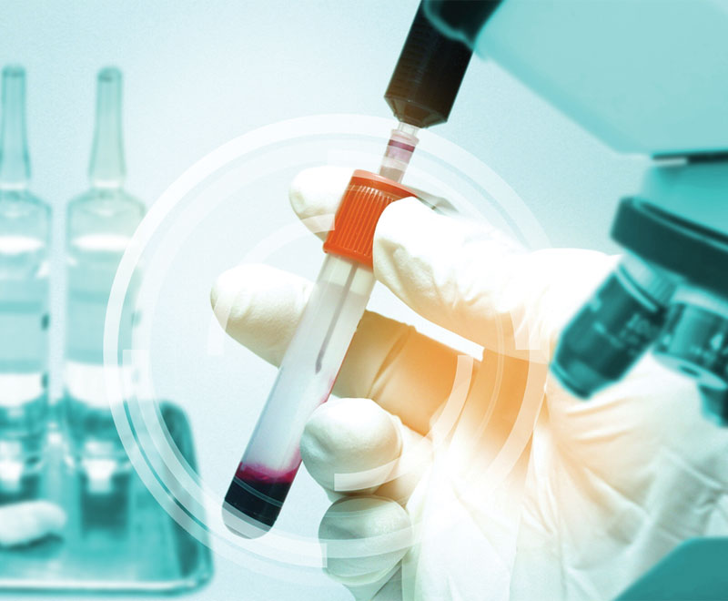 Image of researcher working with vials of human blood