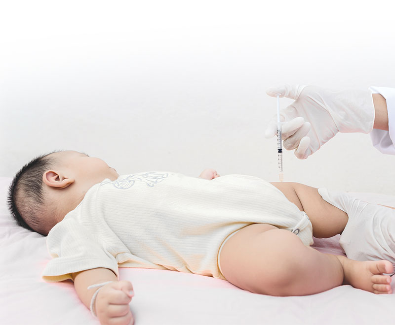 Photo of a baby receiving a vaccine.