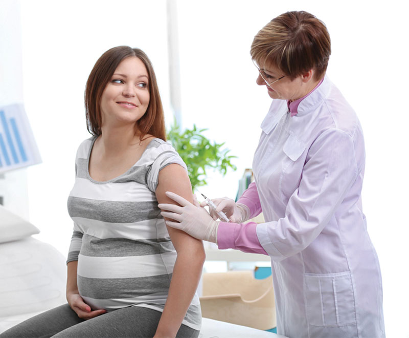 Pregnant woman receiving a vaccine