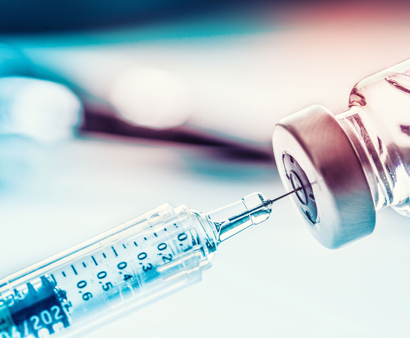 Image of syringe in a medicine bottle