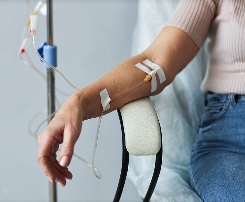 Photo of a female patient receiving IVIG therapy