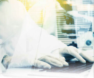 Illustration of a researcher typing on a laptop