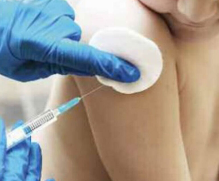 Photo of a young child receiving a vaccine