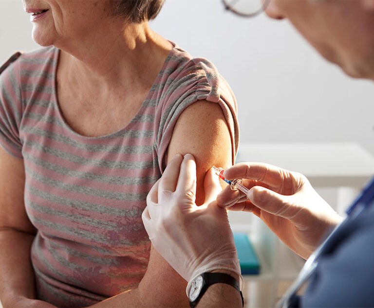 Photo of giving an elderly person a vaccine