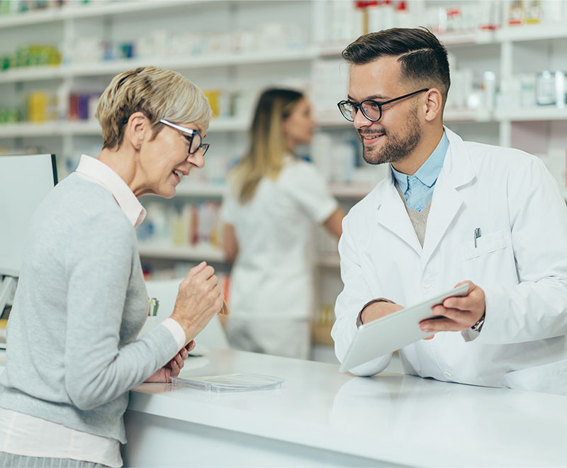 A pharmacist consulting a patient.