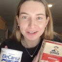 Caroline Cray Quinn holding a box of oatmeal and a container of powdered formula.