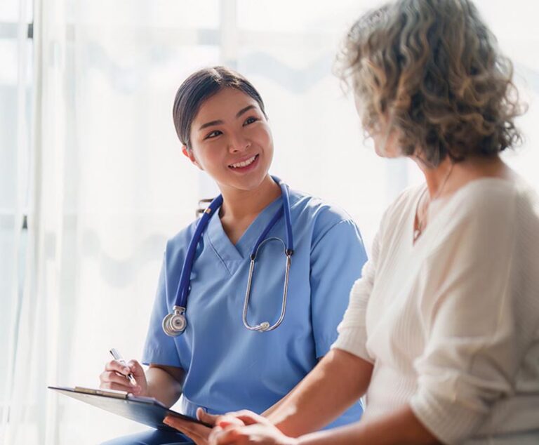 Medical provider speaking to a patient.